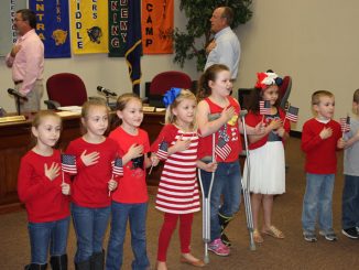 Students shown reciting the Pledge