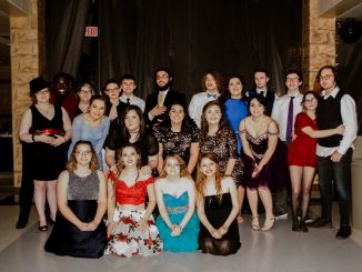 A sharped dress group posing for a photo before entering the Knox Central snowball for a night of dancing, food, and friendship.