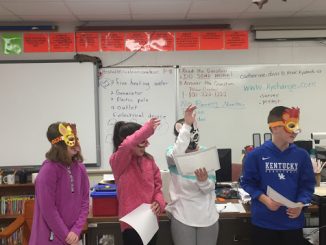 Students dressed as zoo characters to demonstrate the voting and leadership process using a zoo as the example.