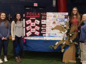 FCCLA students shown with a display exhibit at the career showcase held at Knox Central.