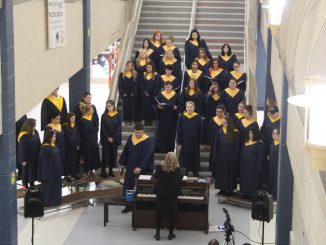 The halls of Knox Central High School were filled with music and artwork. In this photo the choir is practicing on the stairs for their performance.