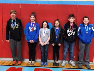 Students are shown wearing medals having placed at the 6th grade showcase.