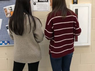 Students are shown in the hallway at Knox Central on a right triangle scavenger hunt.