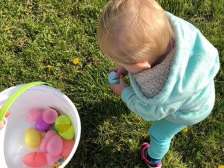 Child shown hunting Easter eggs during the Save the Children egg hunt.