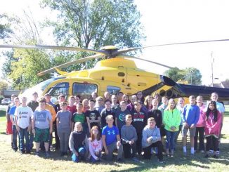 Lay students posed around a Air Medic helicopter as apart of school safety week.