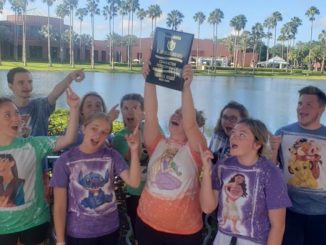 Lynn Camp Beta Club members are all smiles as they hold up their 7th place national plaque.