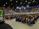 Knox Central seniors seated on the floor at The Arena during graduation ceremonies