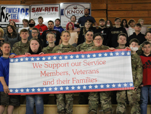 Knox County JROTC cadets holding sign that they support and remember our veterans